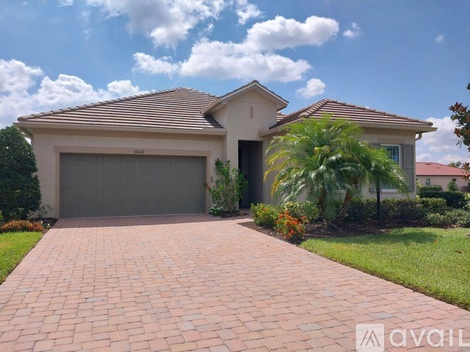 A house with a driveway in front of it.