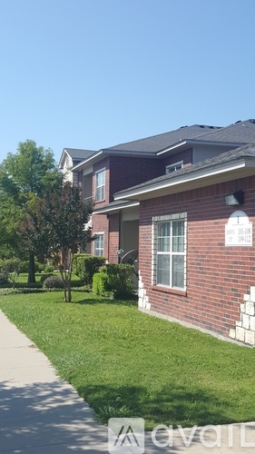 A house with a red brick exterior and a white window.