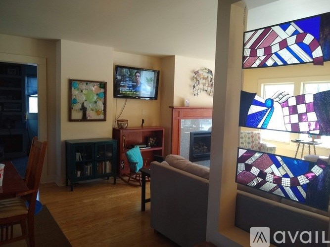 A living room with a television and a couch.
