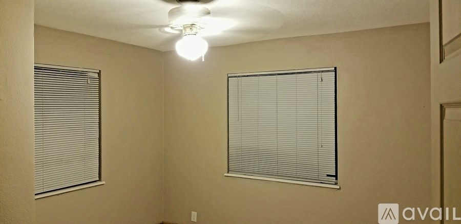 A room with a window and a light on.