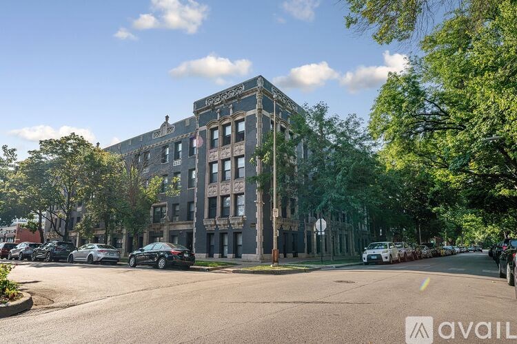 A street view of a large building with the word "avail" on it.