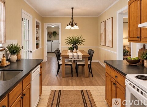 A dining room with a wooden table and chairs.
