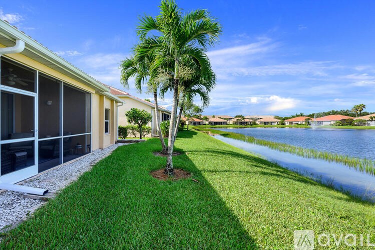 A house with a palm tree in front of it.