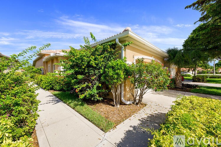 A house with a well-maintained garden in front.