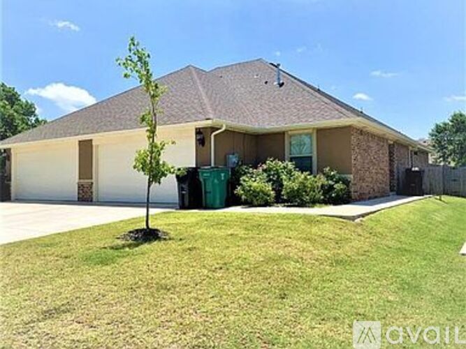 A house with a green tree in front of it.