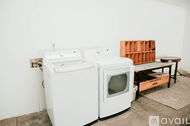 A white oven and microwave in a kitchen.