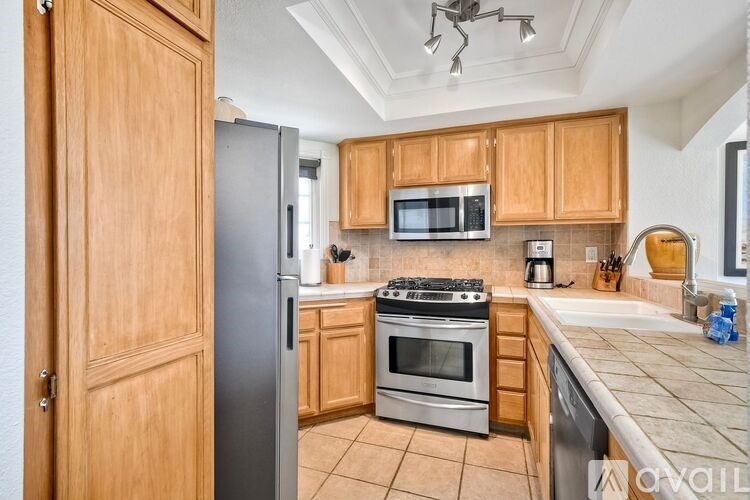 A house numbered 46 has a white door and a window.