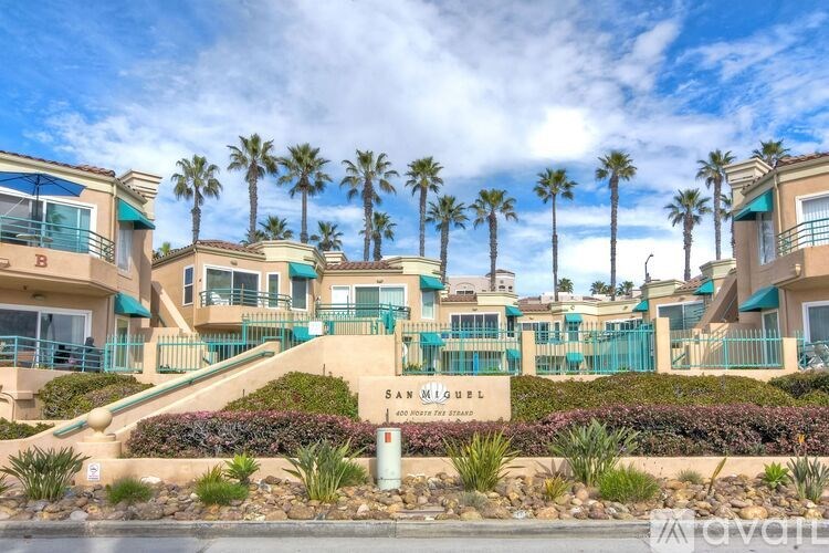 The image shows a residential area with a sign that reads "SAN MIGUEL".