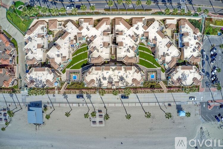 A bird's eye view of a residential area with houses and streets.