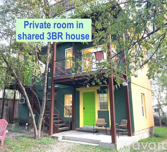 A green and yellow house with a private room in a shared 3BR house.