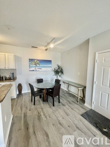 A dining area with a table and chairs is shown in the image.