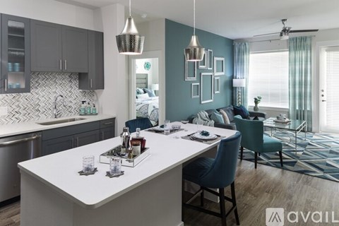 A modern kitchen with a dining area in the foreground.