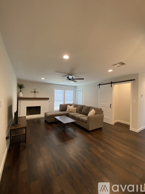 A living room with a fireplace and a couch.