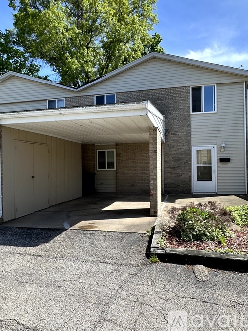 A house with a garage and a driveway.