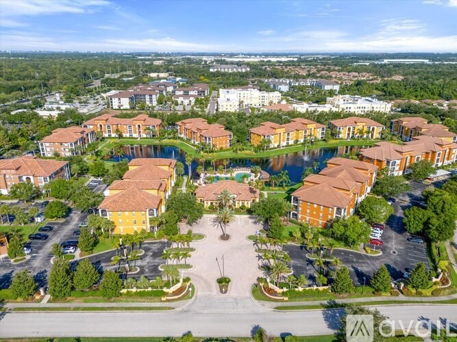 A bird's eye view of a community with a large central green space and houses surrounding it.