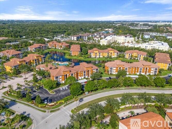 A bird's eye view of a residential area with houses and a swimming pool.