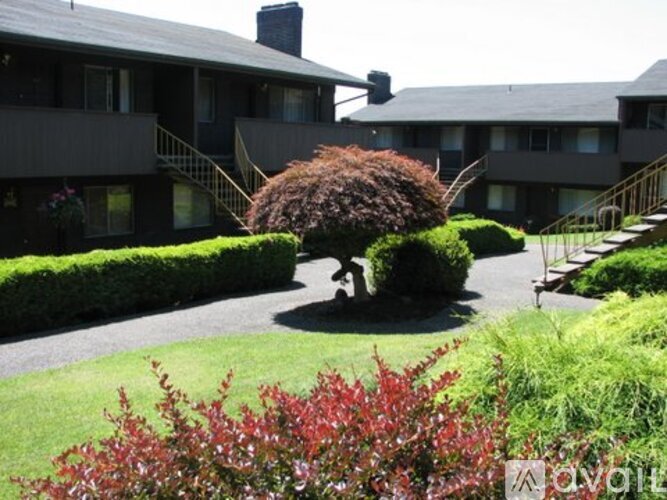 A building with a green lawn in front of it.