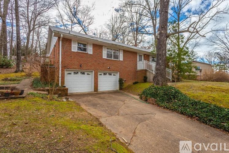 A two-story house with a garage is for sale.