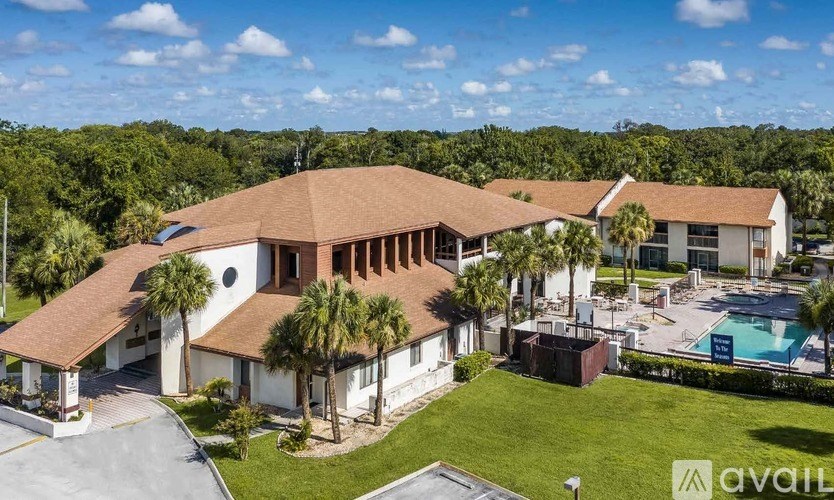 A large house with a pool in front of it.