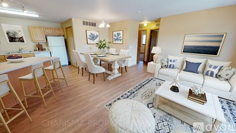 A living room with a white couch and a coffee table.