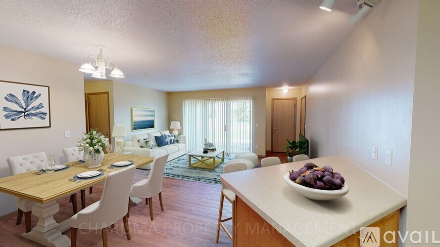 A dining room with a wooden table and chairs.