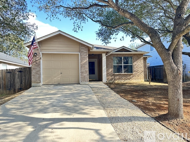 A house with a garage and a flag on the wall.