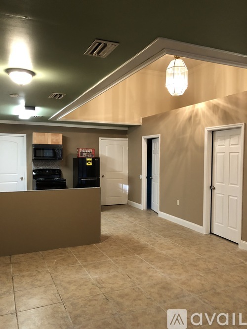 A reception area with a counter and a microwave.