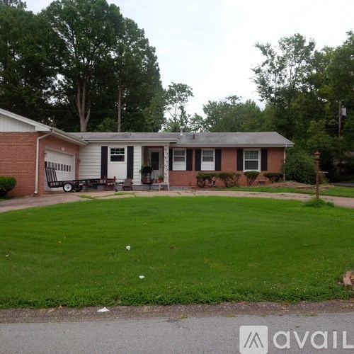 A house with a lawn in front of it.