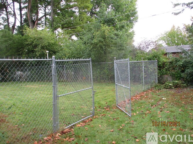 A chain link fence with a date stamp of 10/15/2021.