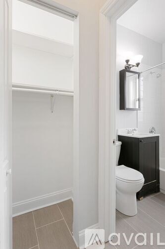 A bathroom with a toilet and a sink.