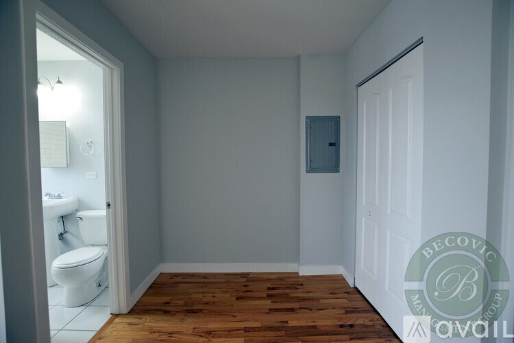 A bathroom with a toilet and sink is available for rent.