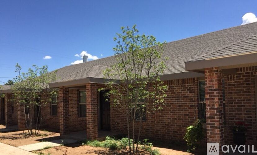 A row of houses with a sign that says "available" in front of the first one.
