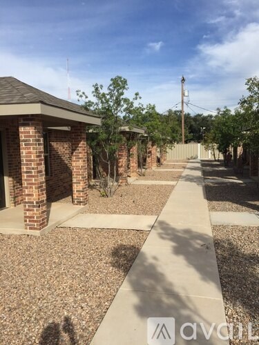 A sunny day at the brick building with a clear blue sky.