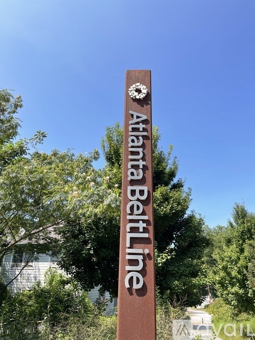 A sign that says Atlanta Beltline in front of trees.
