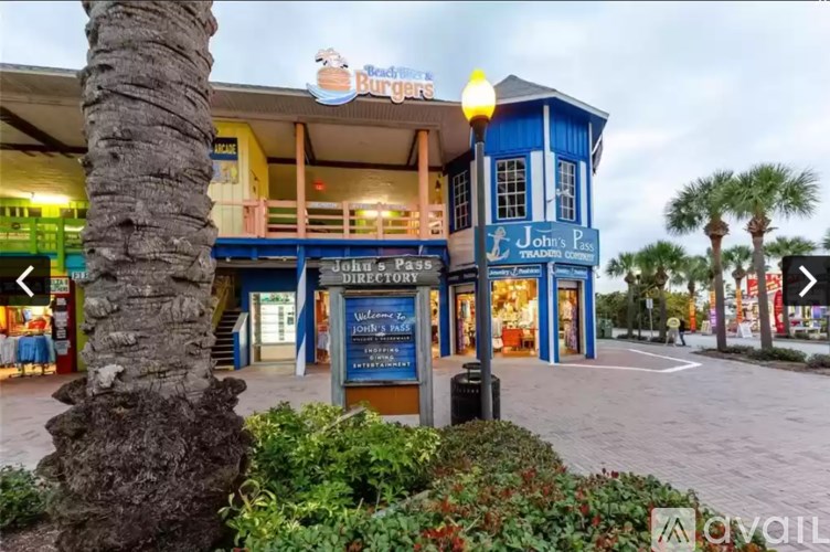 A building with a sign that says John's Patio Trading Center.