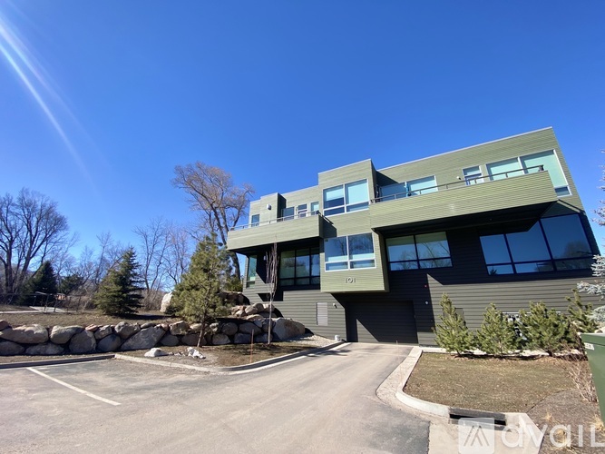 A modern building with a curved design and large windows.