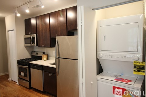 A kitchen with a white fridge and a white oven.