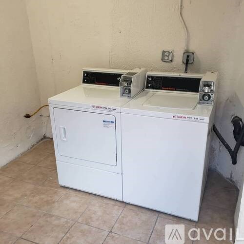 A white appliance with a black handle on the right side.