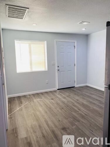 A room with a door and a window.
