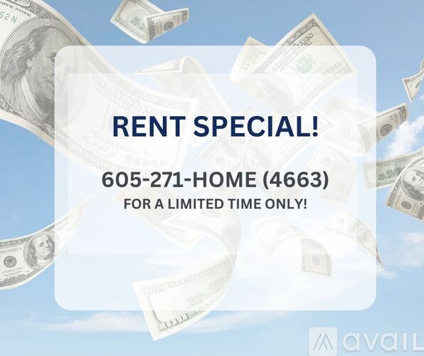 A room with a wooden floor and a window with blinds.