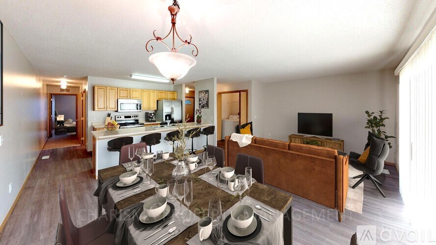 A dining room with a table set for six people.