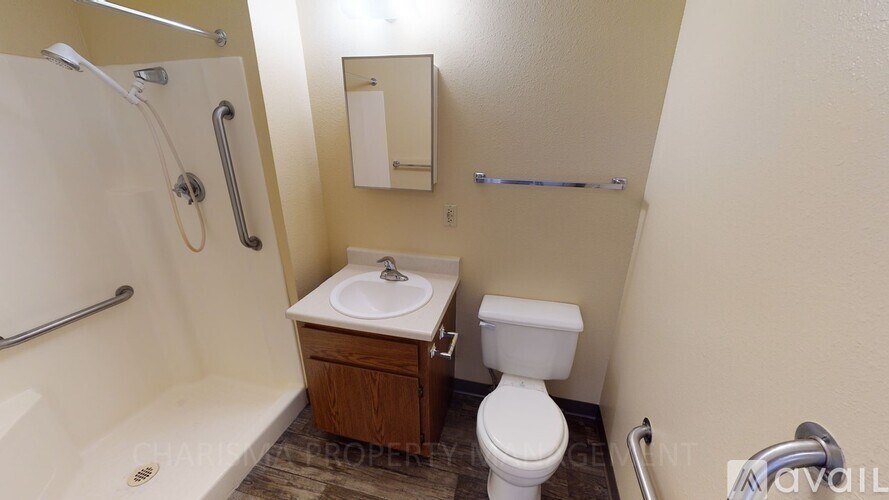 A bathroom with a toilet, sink, and bathtub.