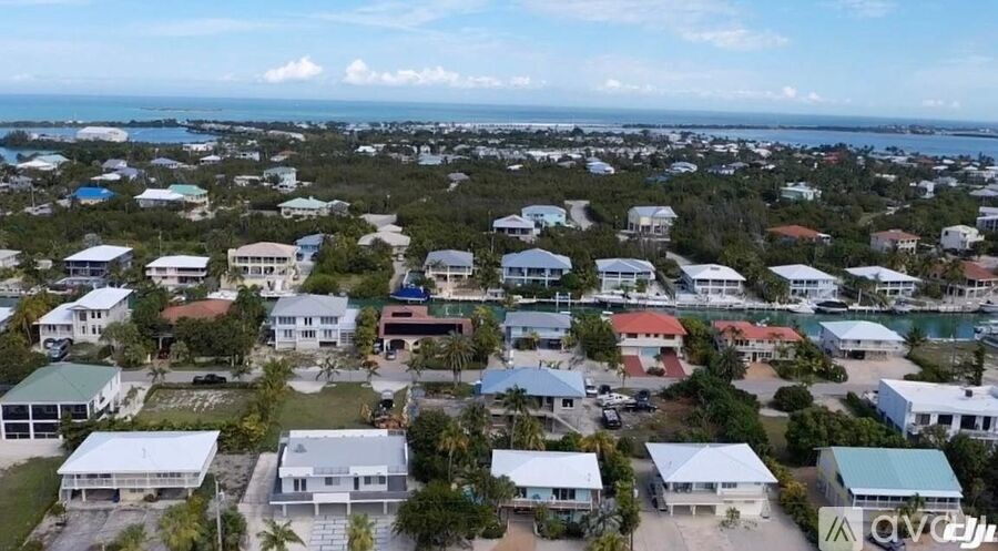 A bird's eye view of a residential area with houses and buildings.
