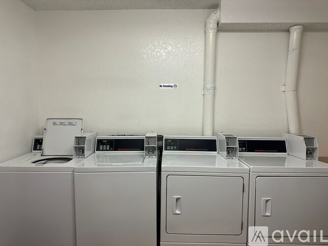 A row of washing machines are available for rent.