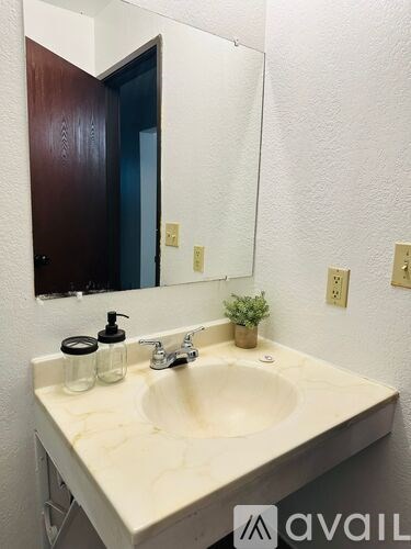 A bathroom sink with a mirror above it.