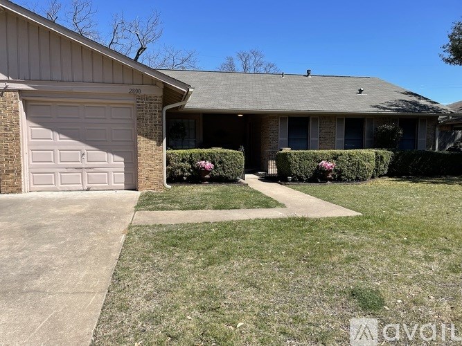 A house with a driveway and a garage.