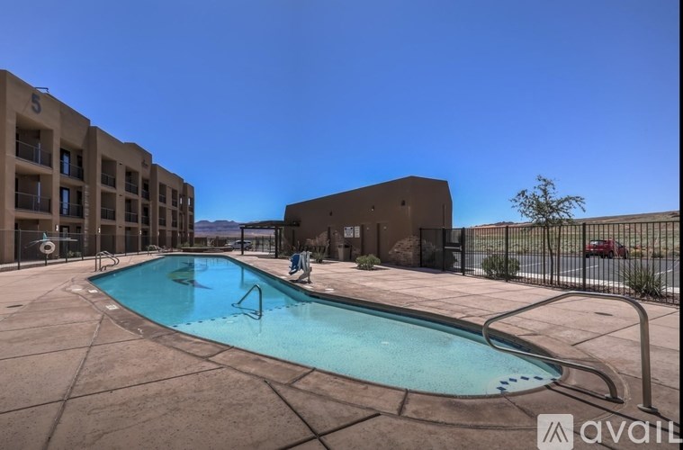 A swimming pool in a courtyard surrounded by buildings.