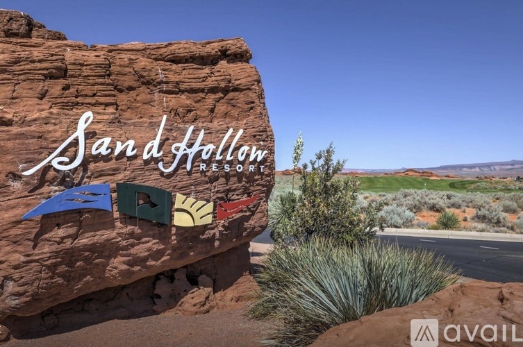 A rock with the words "Sand Hollow Resort" written on it.
