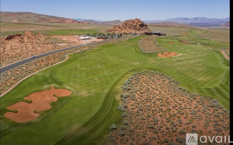 A golf course with a green and brown area.
