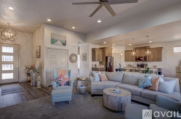 A living room with a grey couch and a wooden coffee table.